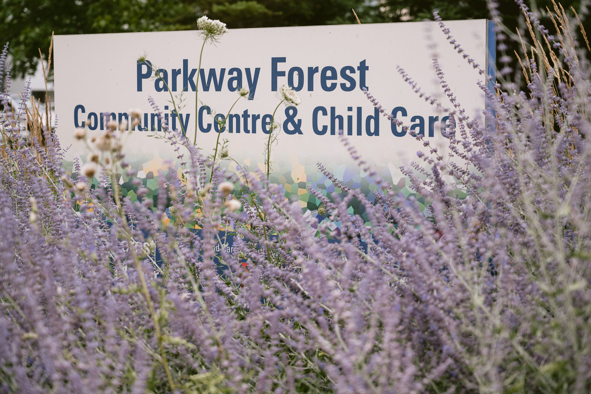 A building sign that says, “Parkway Forest Community Centre & Child Care.”